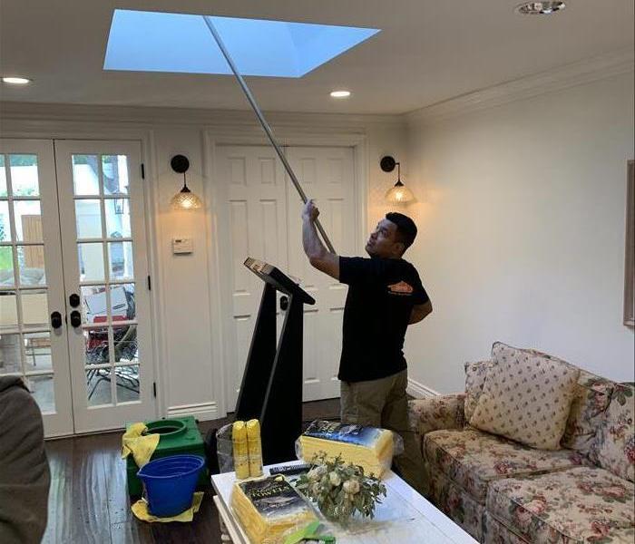 A SERVPRO specialist cleaning soot from a fire.